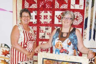 Jan Easton of Quilts of Valour - Canada and quilter Sue Fiddes at the Land O' Lakes Quilters meeting and presentation in Cloyne on May 26